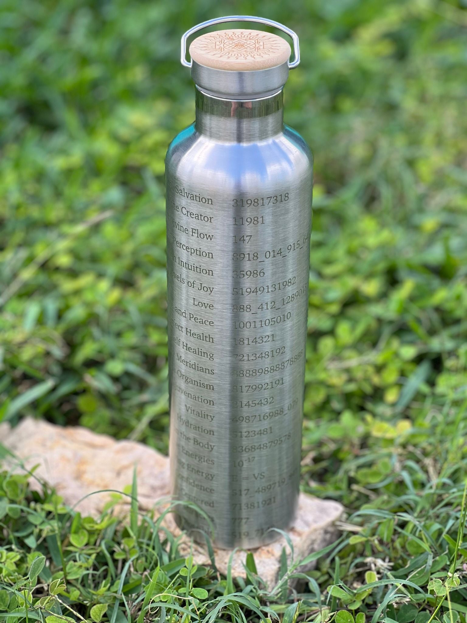 1L silver stainless steel Grabovoi bottle with engraved energy codes to transform water and support vibrational healing.