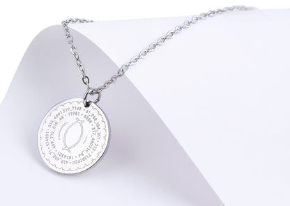 Silver necklace with a round pendant on a white background