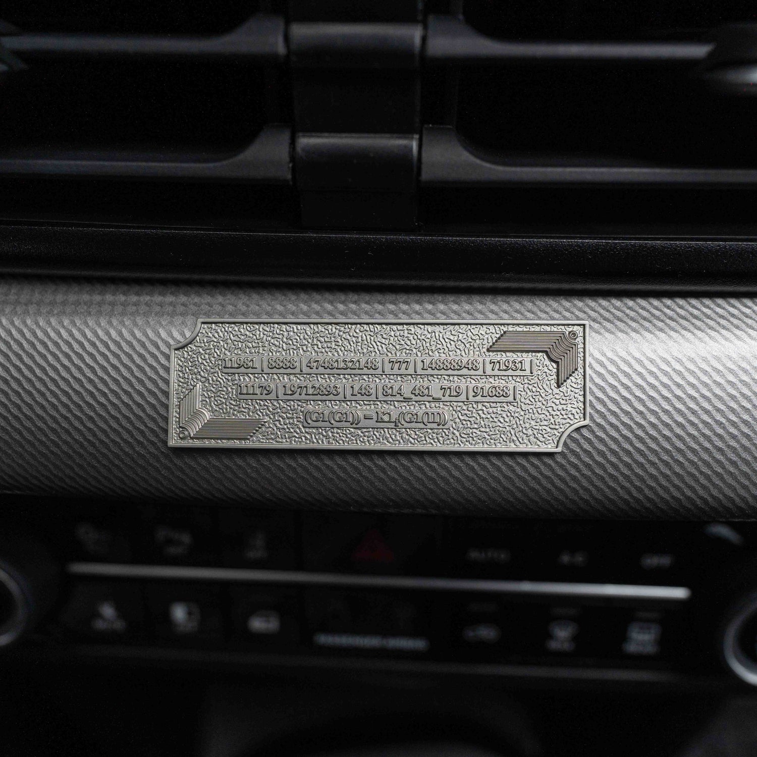 Metallic Grabovoi number charm for vehicles, designed to enhance protection, remove obstacles, and harmonize travel energy